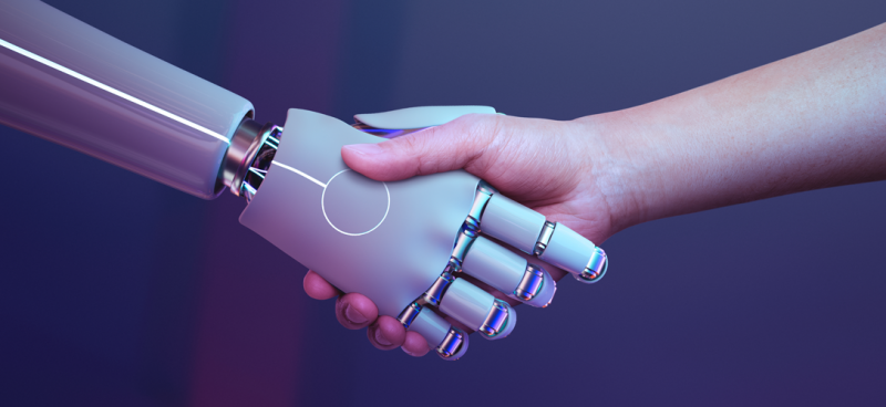mão de um robô se juntando com a mão de um ser humano representando a inteligência artificial